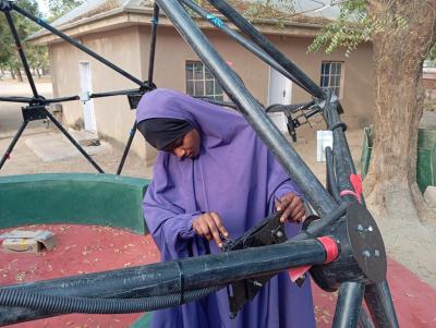 A woman assembling a Hello Hub dome in the Jama'are community image linking to Photo essay: Discover how the collective building of Hello Hubs is bridging the digital divide in Nigeria
